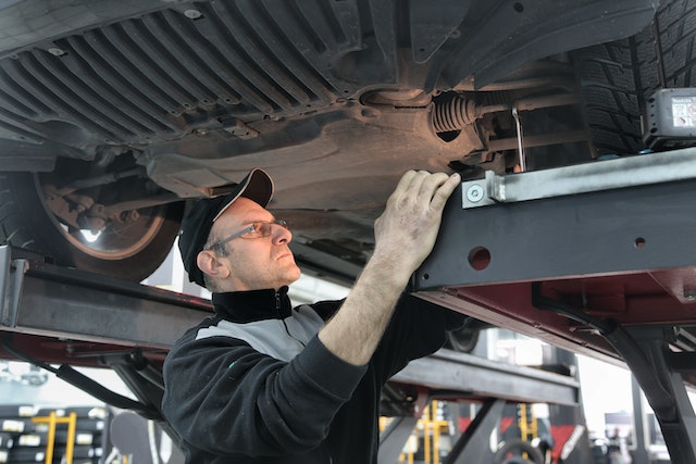 mechanic working on vehicle