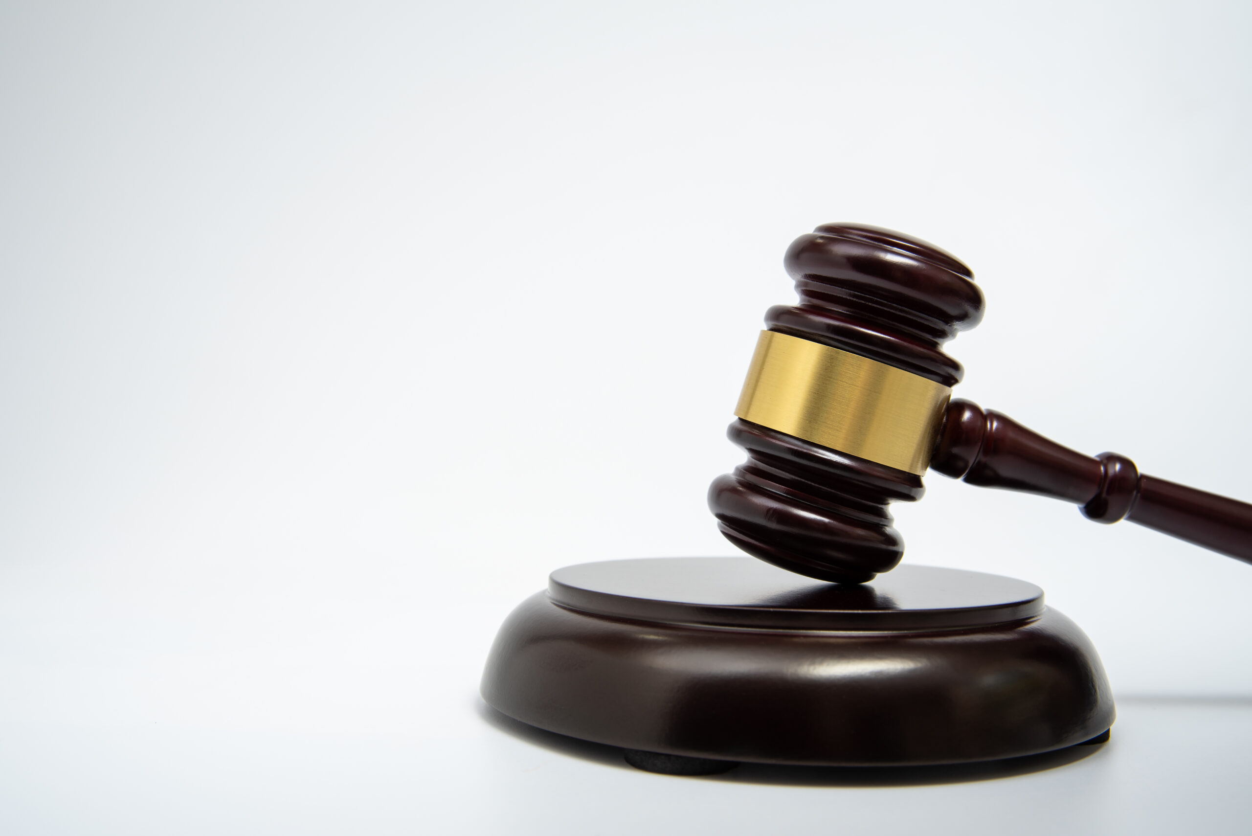 A wooden judge gavel isolated on white background.